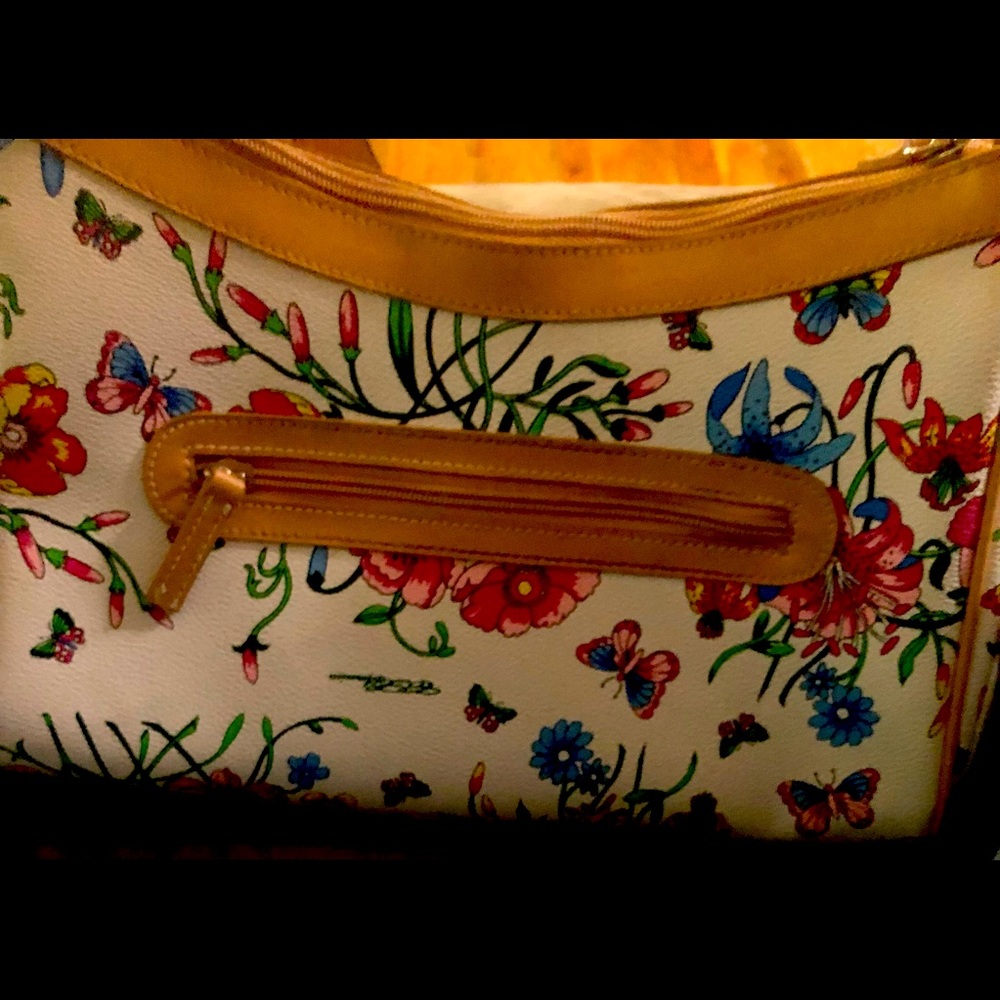 CL America  Floral Purse used but in good condition.